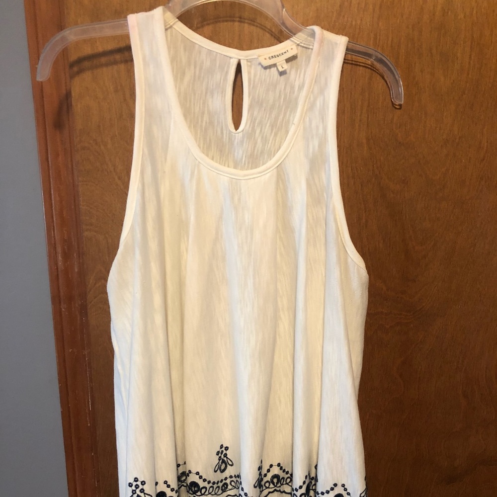 White tank top w/ dark navy blue embroidered edges